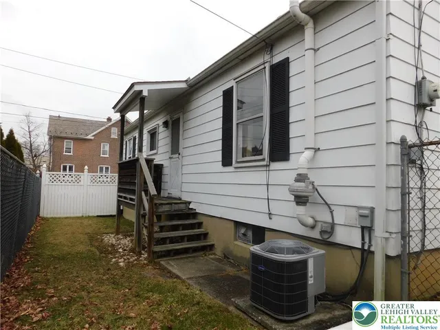 a front view of a house with stairs