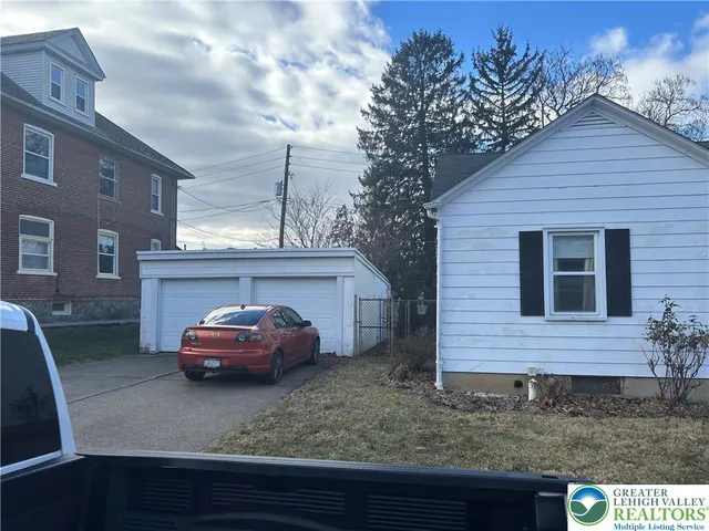 a car parked in front of a house
