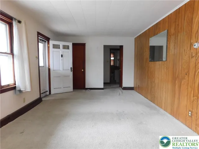 a view of an empty room with a window