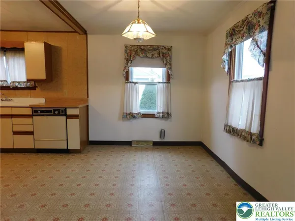 a view of a windows and chandelier in a room