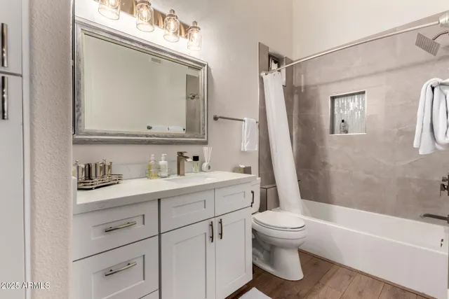 a bathroom with a toilet shower and a sink