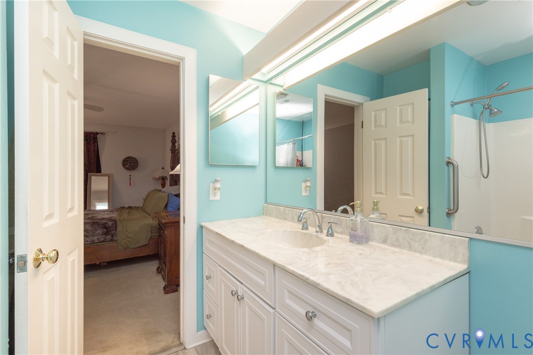 222 Water Pointe Court Midlothian, VA 23112 - Photo 11 of 19 Bathroom featuring a single vanity with a solid su
