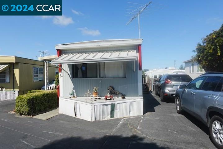 3913 Castro Valley Boulevard, Unit 5 Castro Valley, CA 94546 - Photo 1 of 1 a view of living room that has a couch and a fireplace
