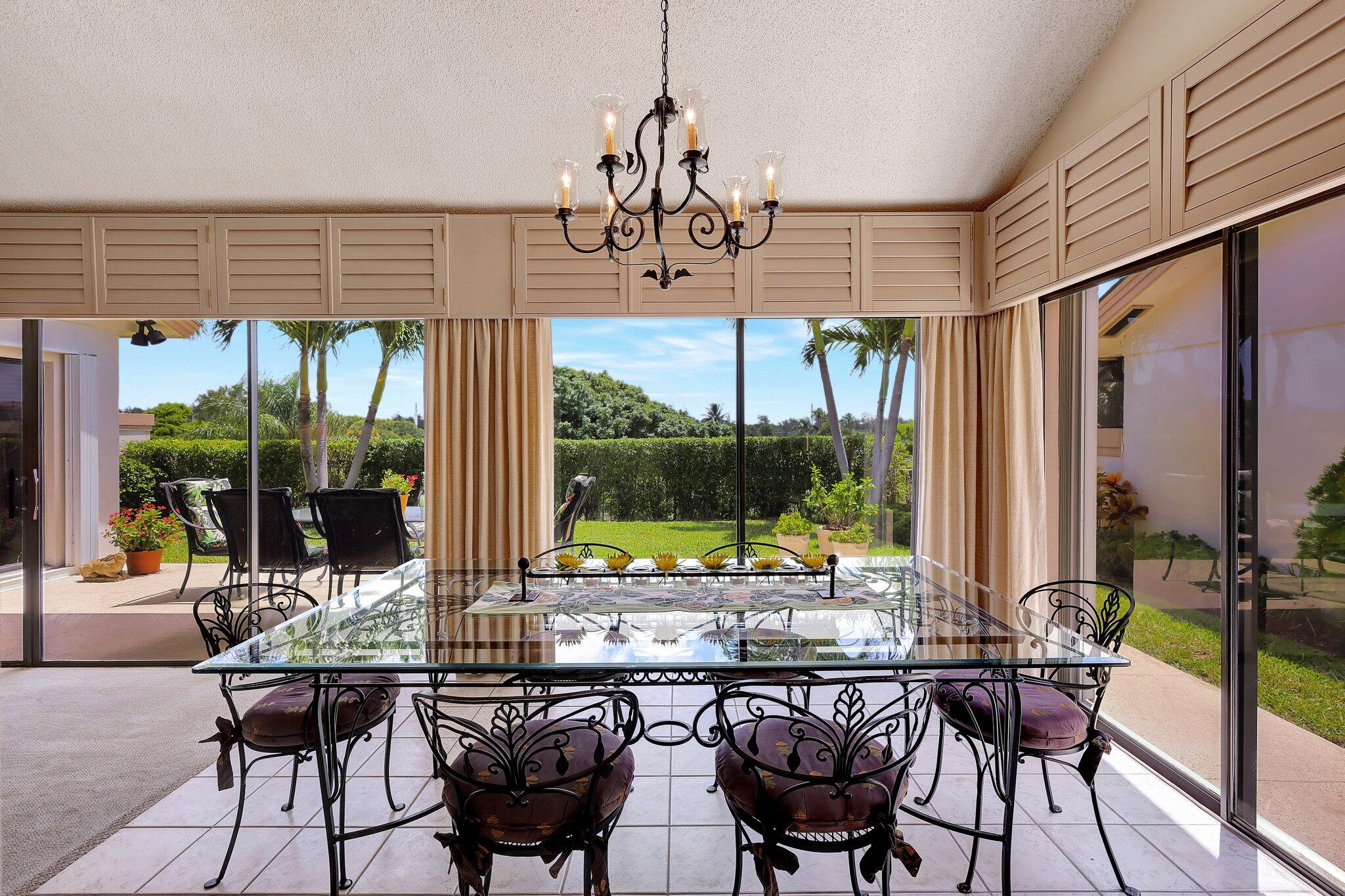 315 Ridge Road Jupiter, FL 33477 - Photo 11 of 42 a view of a chairs and table in patio
