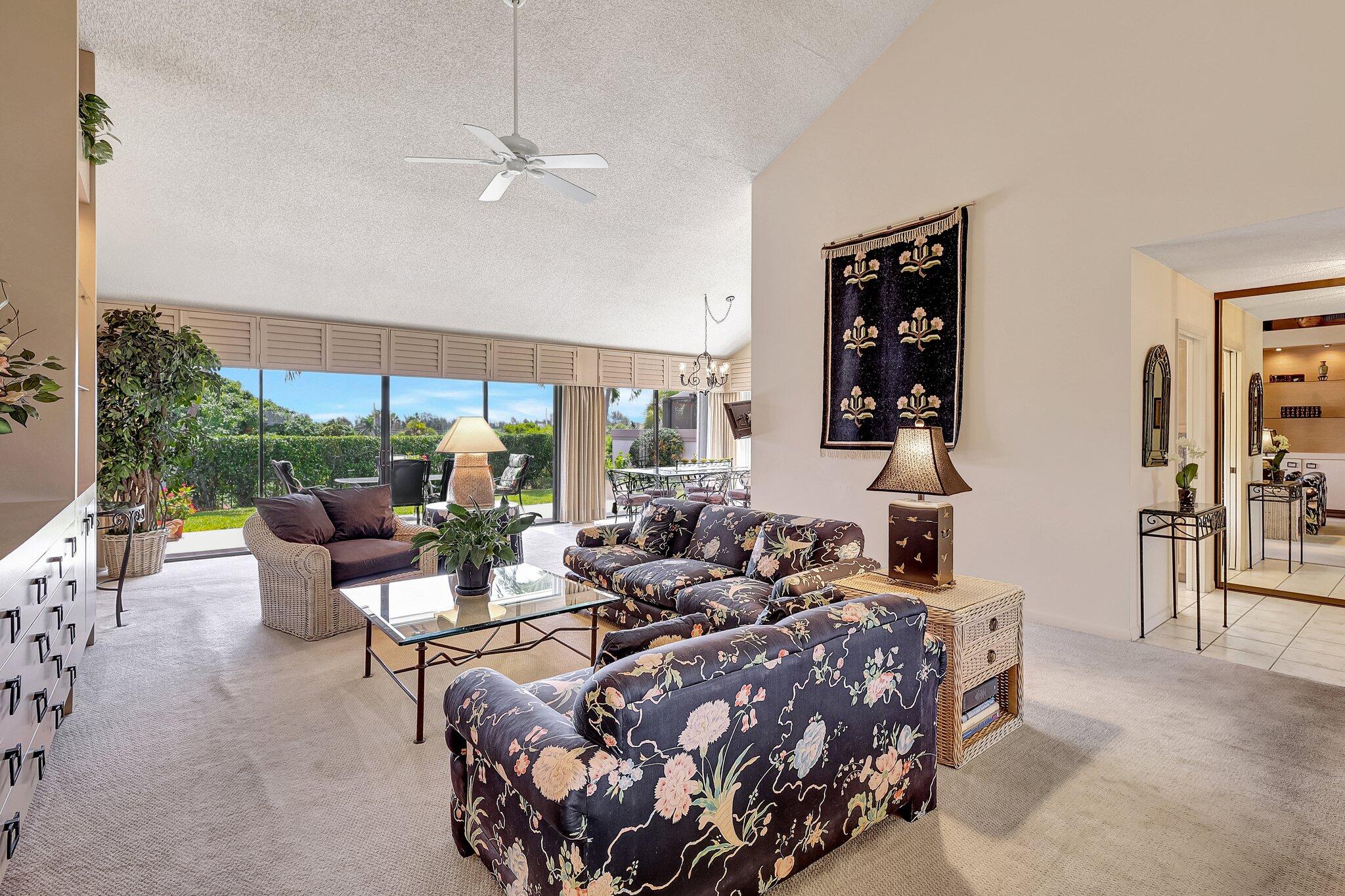 315 Ridge Road Jupiter, FL 33477 - Photo 14 of 42 a living room with furniture and a large window