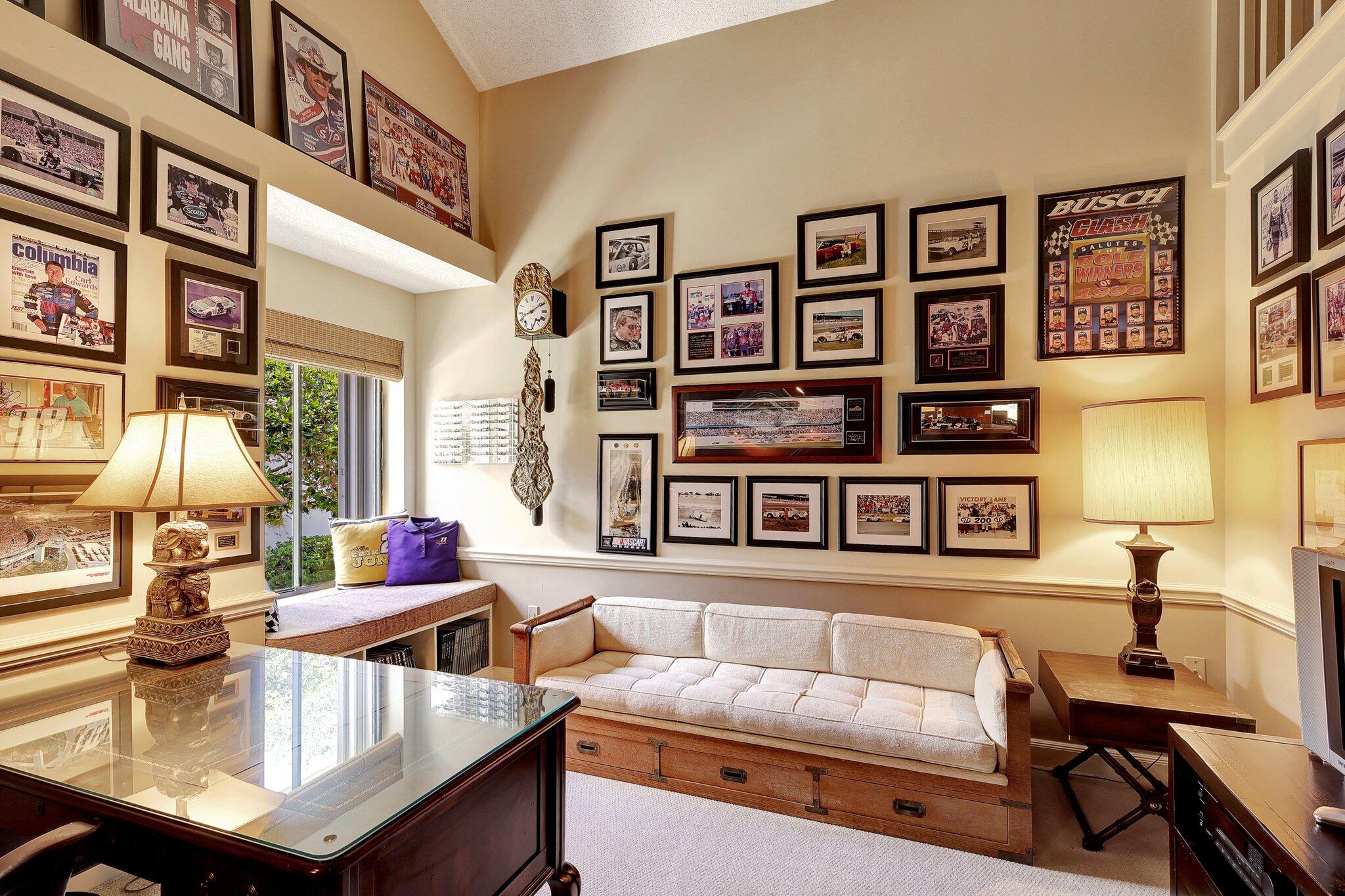 315 Ridge Road Jupiter, FL 33477 - Photo 25 of 42 a living room with furniture and paintings on the wall