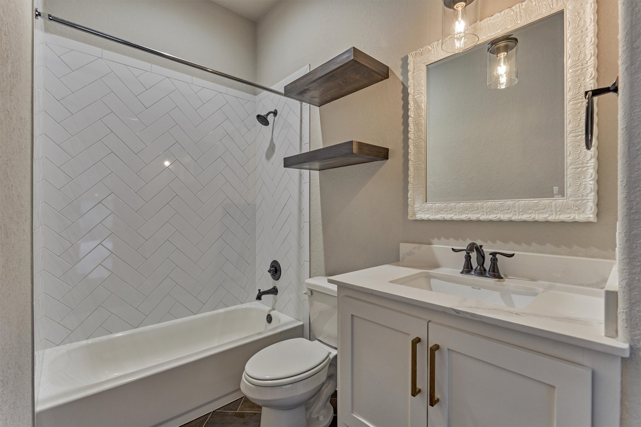 11618 Renaissance Drive Montgomery, TX 77356 - Photo 29 of 49 The en-suite bath mimics many of the same designer finishes found throughout the home, creating a cohesive and polished look.