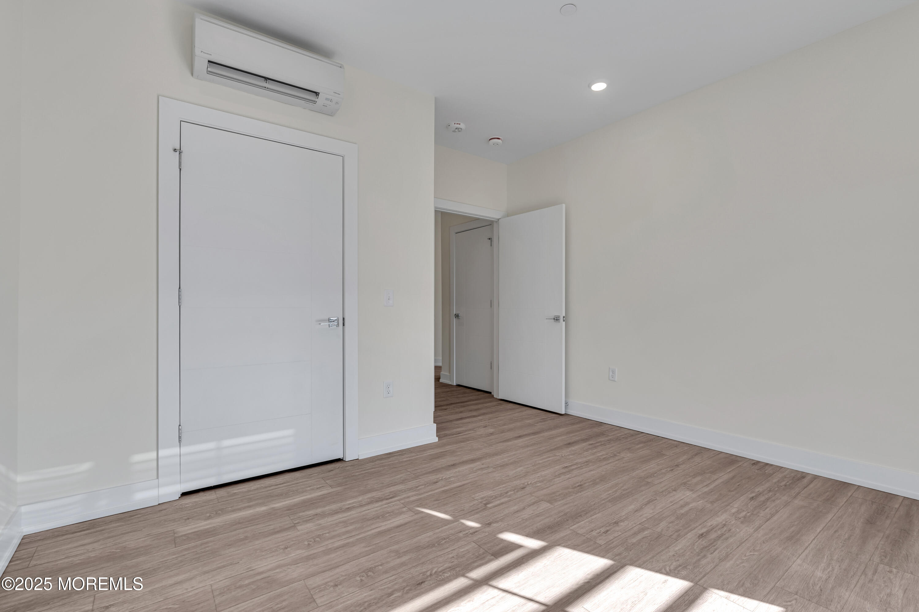 19 Carr Avenue, Unit 219 Keansburg, NJ 07734 - Photo 13 of 22 a view of an empty room with wooden floor