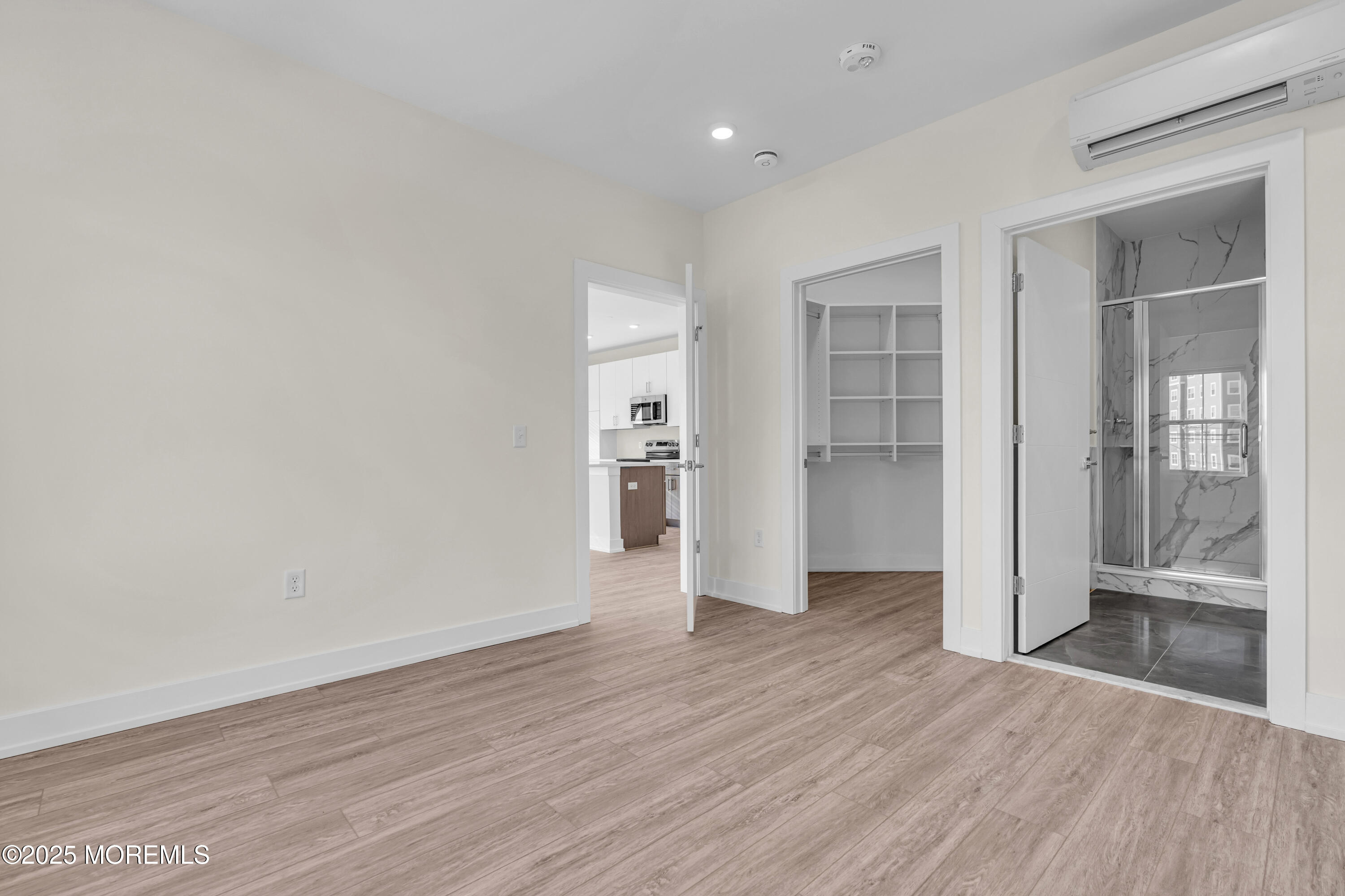 19 Carr Avenue, Unit 219 Keansburg, NJ 07734 - Photo 20 of 22 a view of an empty room with wooden floor and a window