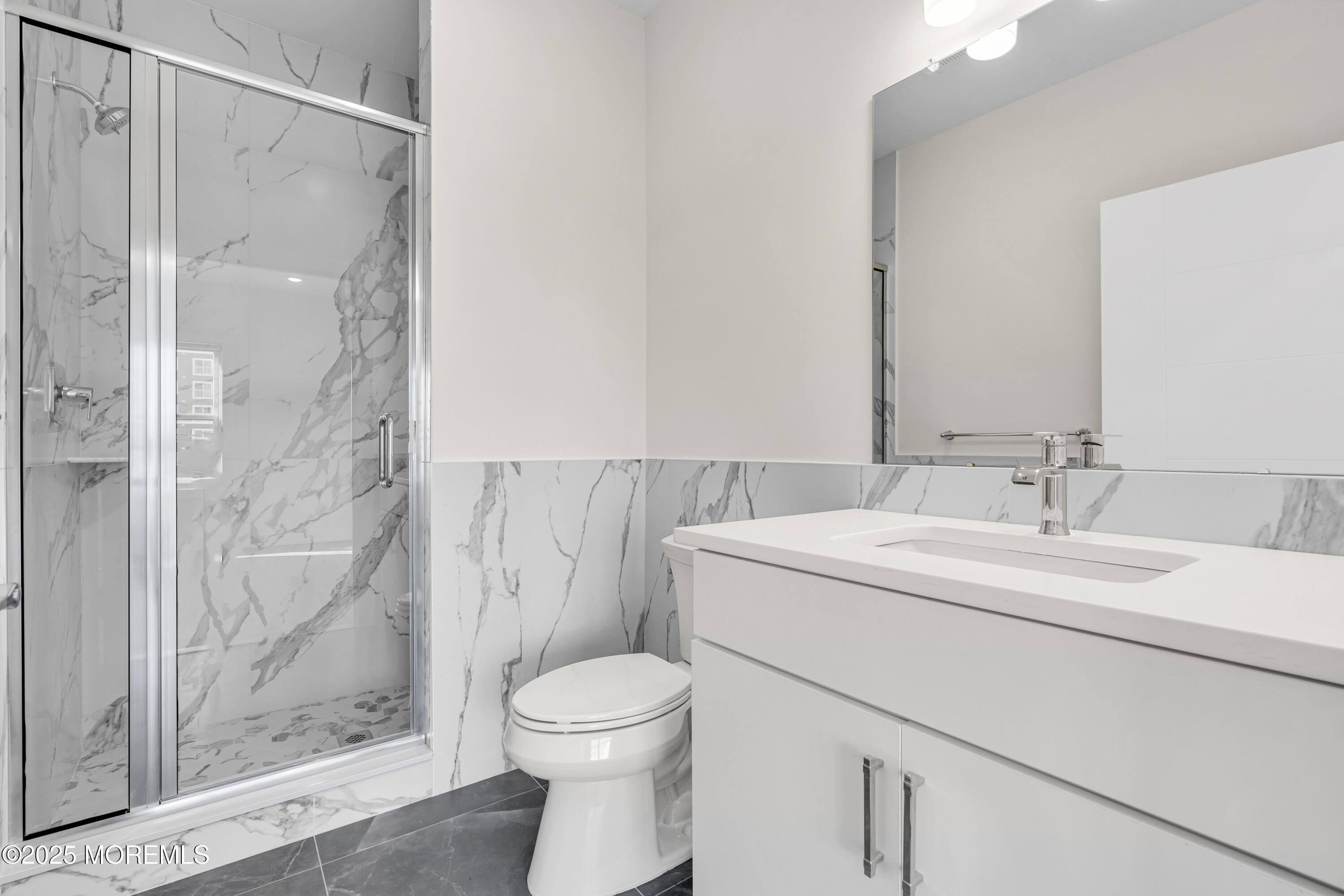 19 Carr Avenue, Unit 219 Keansburg, NJ 07734 - Photo 22 of 22 a bathroom with a sink and a mirror