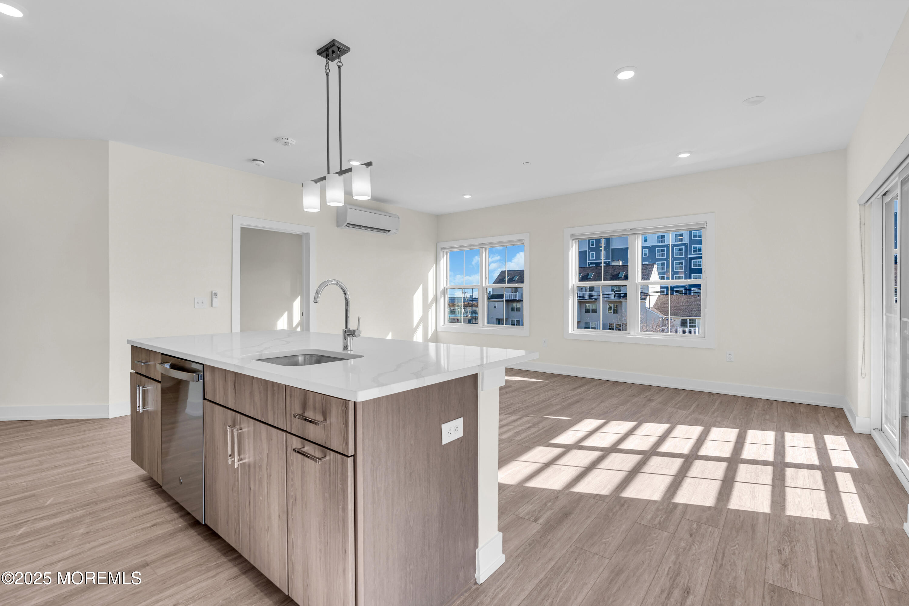 19 Carr Avenue, Unit 219 Keansburg, NJ 07734 - Photo 7 of 22 a kitchen with kitchen island granite countertop a sink cabinets and window