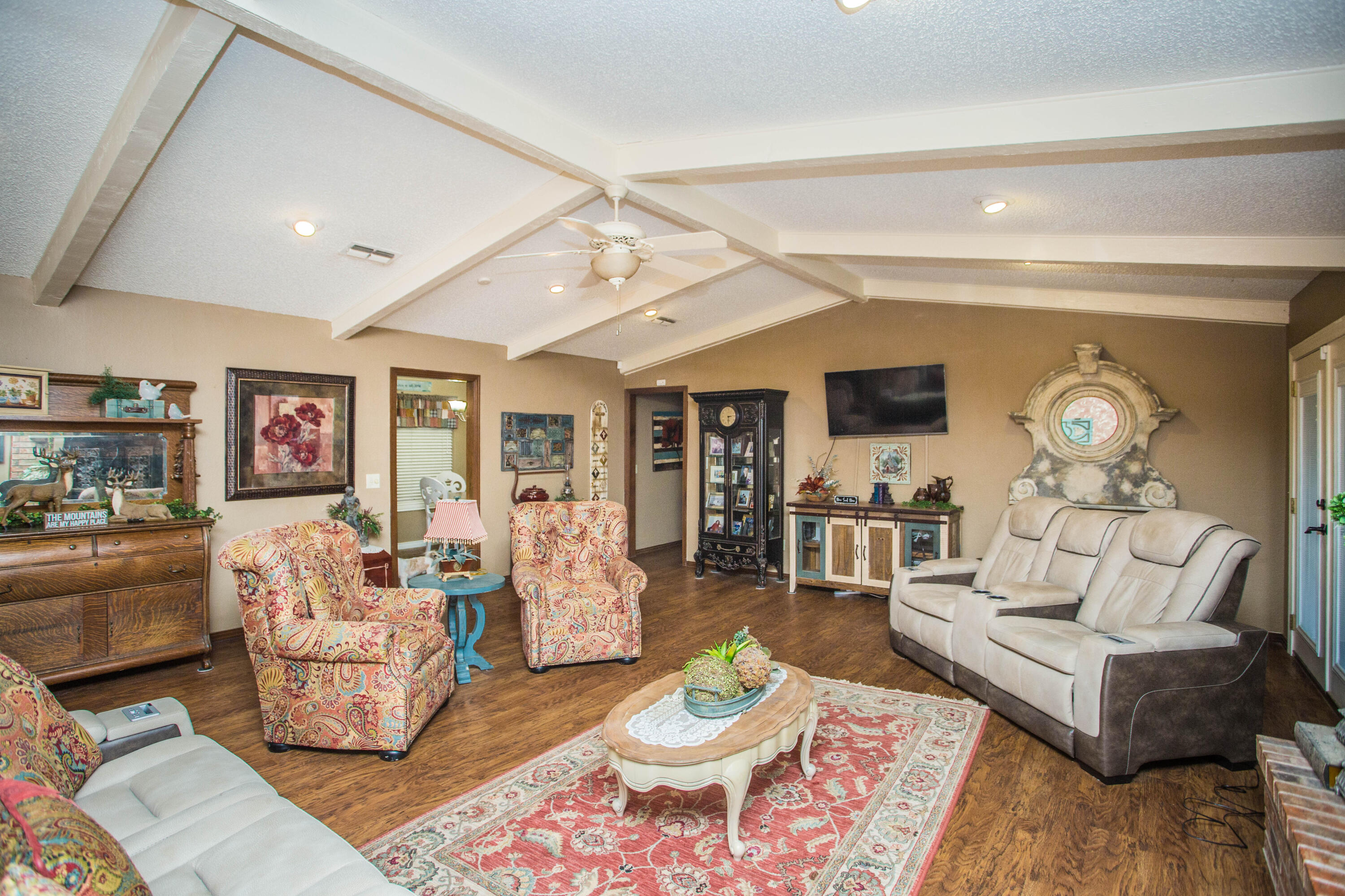 1304 Jefferson Drive Plainview, TX 79072 - Photo 13 of 50 a living room with furniture and wooden floor