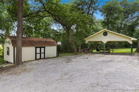 a house with trees in the background