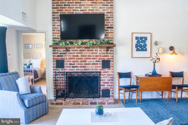 1223 Eagles Ridge Drive, Unit 23 Chesterbrook, PA 19087 - Photo 2 of 24 Living room with wood burning fireplace