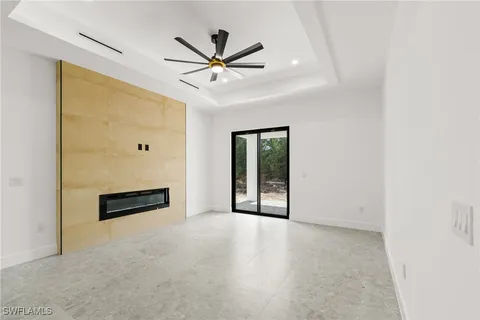 a view of a livingroom with a ceiling fan and window