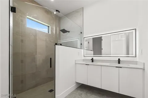 a bathroom with a sink and mirror