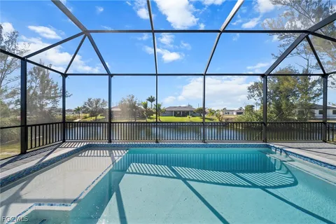 a view of a swimming pool with a patio