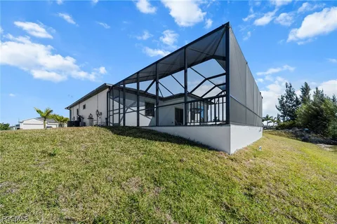 a front view of a house with a yard and a garage
