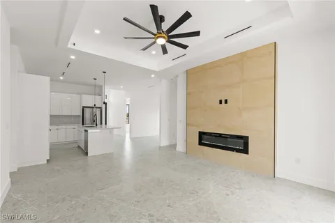 a view of a livingroom with a kitchen