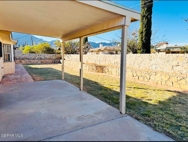 a view of a backyard of the house