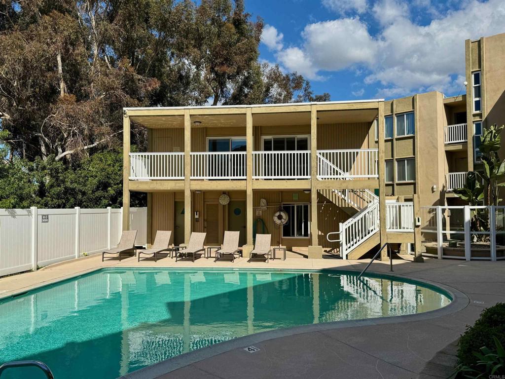 3030 Suncrest Drive, Unit 702 San Diego, CA 92108 - Photo 14 of 17 a view of a house with a swimming pool