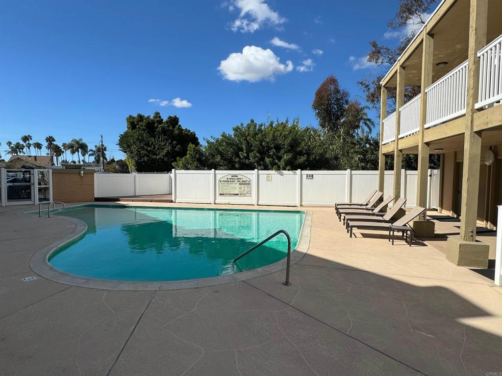 3030 Suncrest Drive, Unit 702 San Diego, CA 92108 - Photo 15 of 17 a view of a patio with a table and chairs
