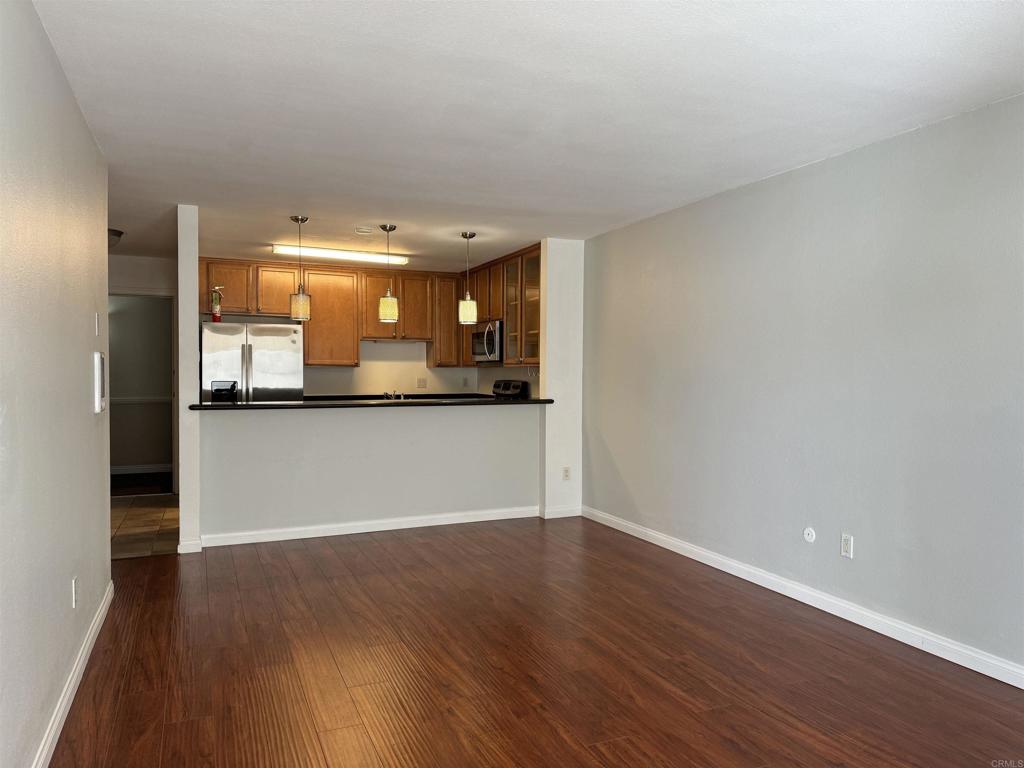 3030 Suncrest Drive, Unit 702 San Diego, CA 92108 - Photo 8 of 17 a view of a kitchen and a window in a room