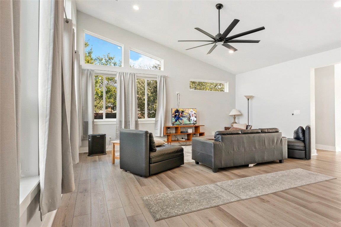 300 Summit Ridge Drive North Point Venture, TX 78645 - Photo 3 of 35 Living room with light wood-type flooring, high vaulted ceiling, ceiling fan, and recessed lighting