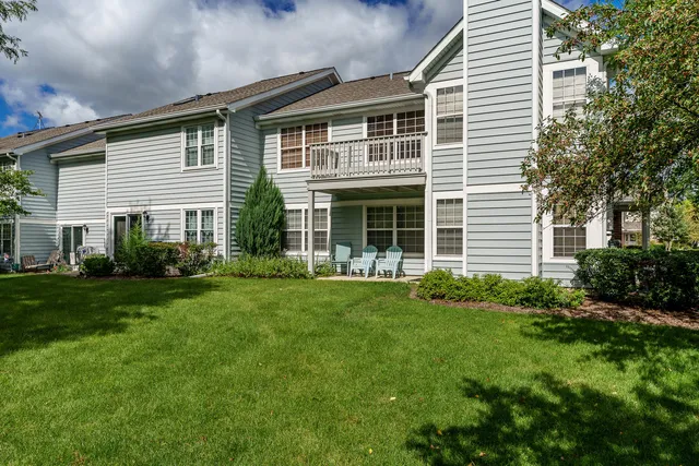 a front view of a house with a yard and porch