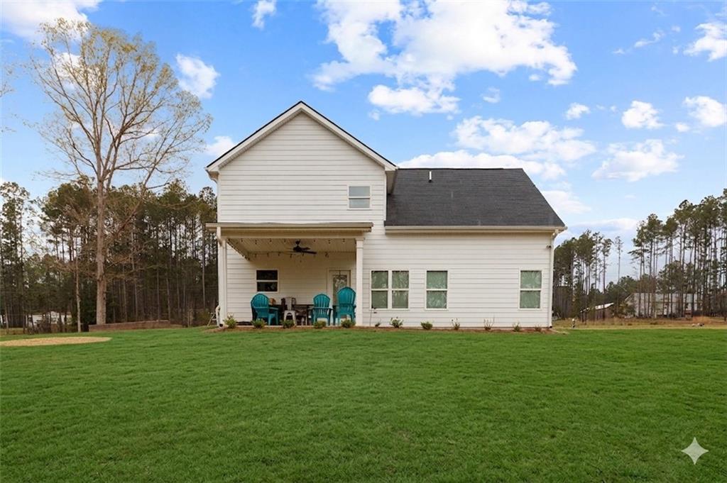 171 Strickland Loop Forsyth, GA 31029 - Photo 24 of 25 a front view of house with yard and green space
