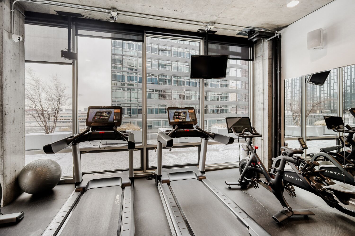 611 South Wells Street, Unit 2304 Chicago, IL 60607 - Photo 13 of 20 a living room with furniture a flat screen tv and a window
