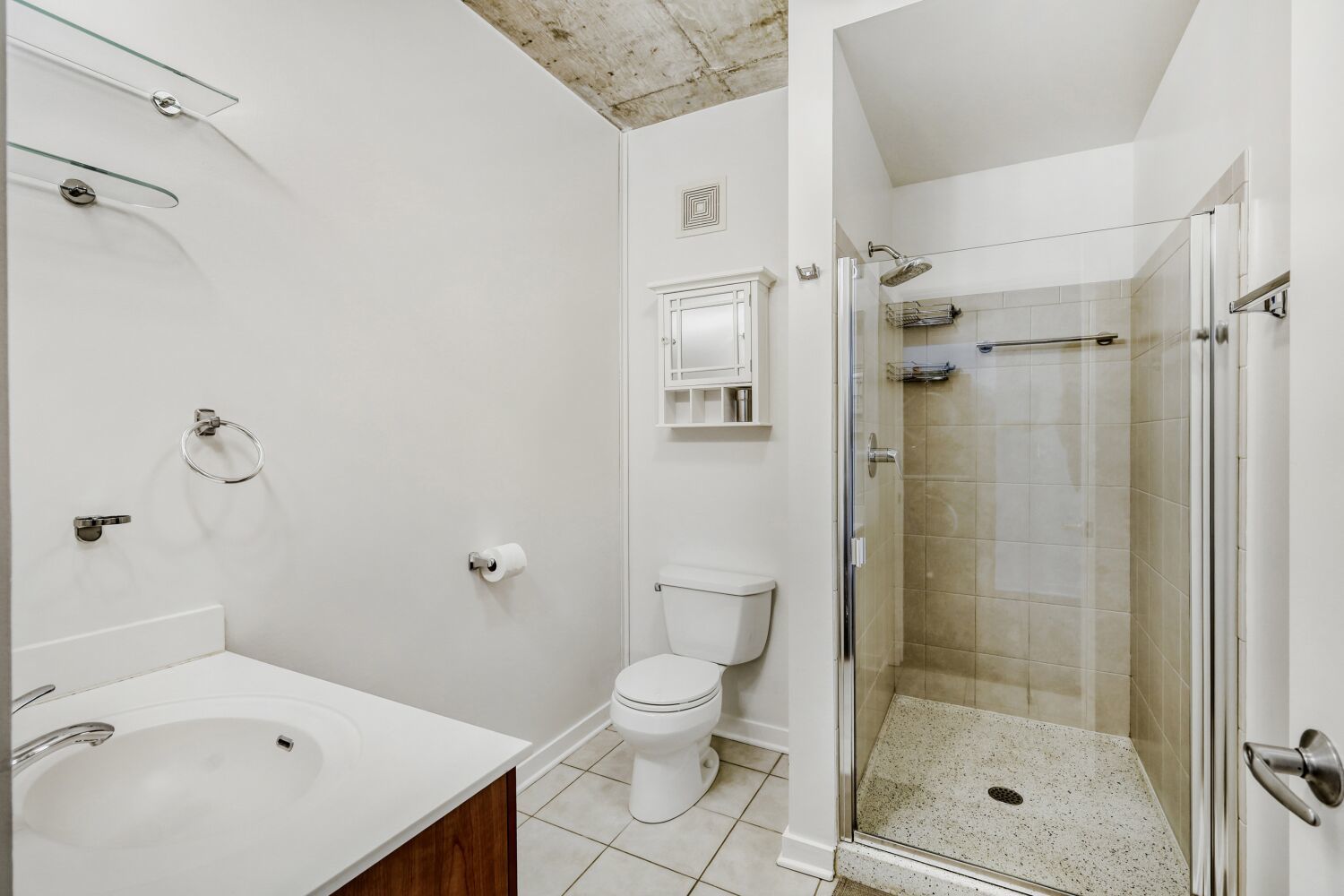 611 South Wells Street, Unit 2304 Chicago, IL 60607 - Photo 15 of 20 a bathroom with a granite countertop sink a toilet and shower