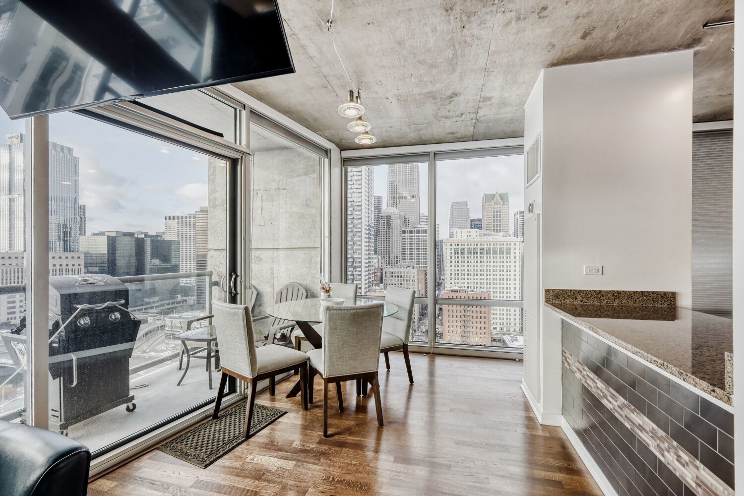 611 South Wells Street, Unit 2304 Chicago, IL 60607 - Photo 4 of 20 a kitchen with stainless steel appliances granite countertop a stove and a refrigerator