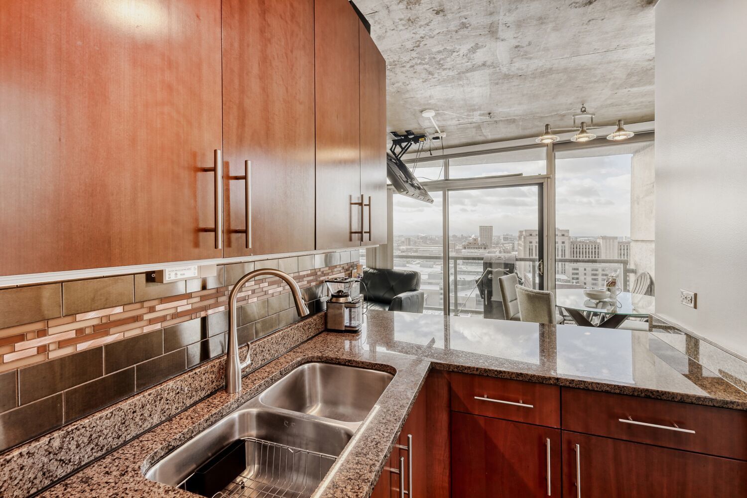 611 South Wells Street, Unit 2304 Chicago, IL 60607 - Photo 6 of 20 a kitchen with a sink and a window
