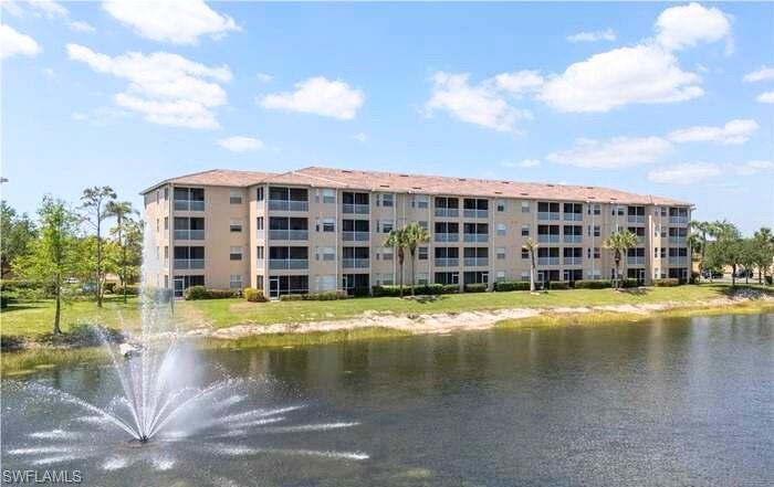 8490 Kingbird Loop, Unit 930 Estero, FL 33967 - Photo 12 of 12 a view of a swimming pool with a lot of buildings