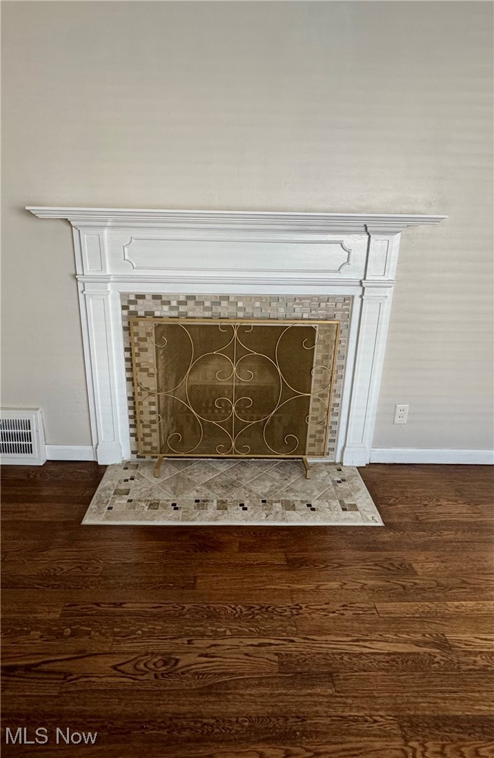 1316 Gordon Road Lyndhurst, OH 44124 - Photo 5 of 36 Wood burning fireplace with newer ceramic tile.