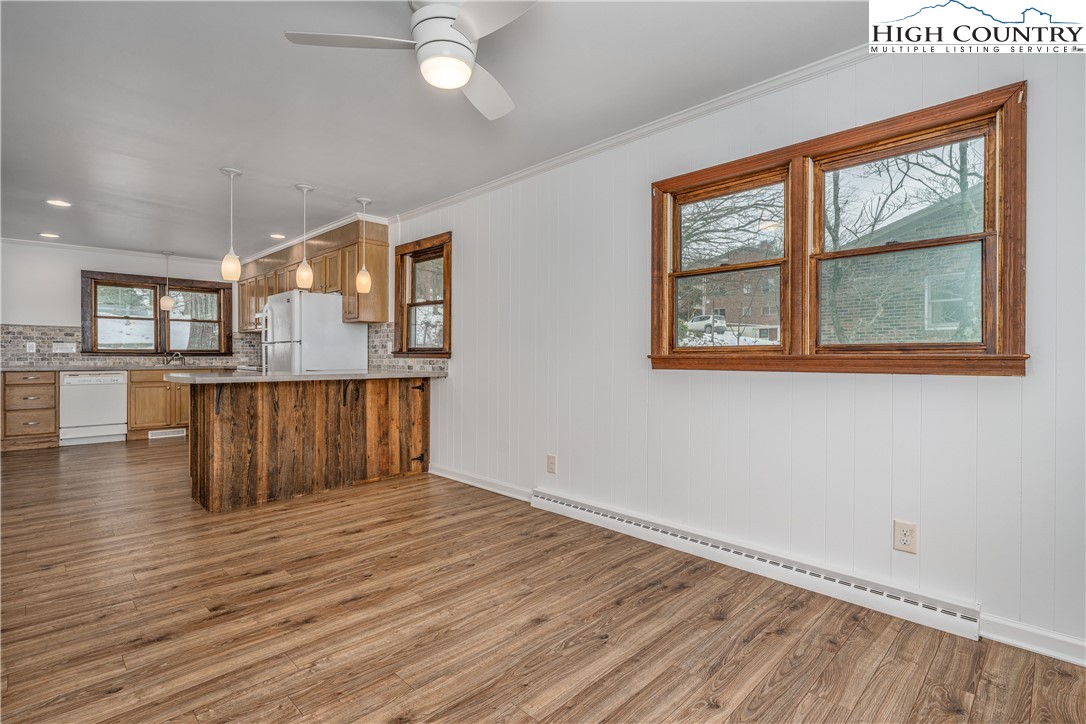 217 Highland Avenue Boone, NC 28607 - Photo 15 of 33 a view of an empty room with wooden floor and a window