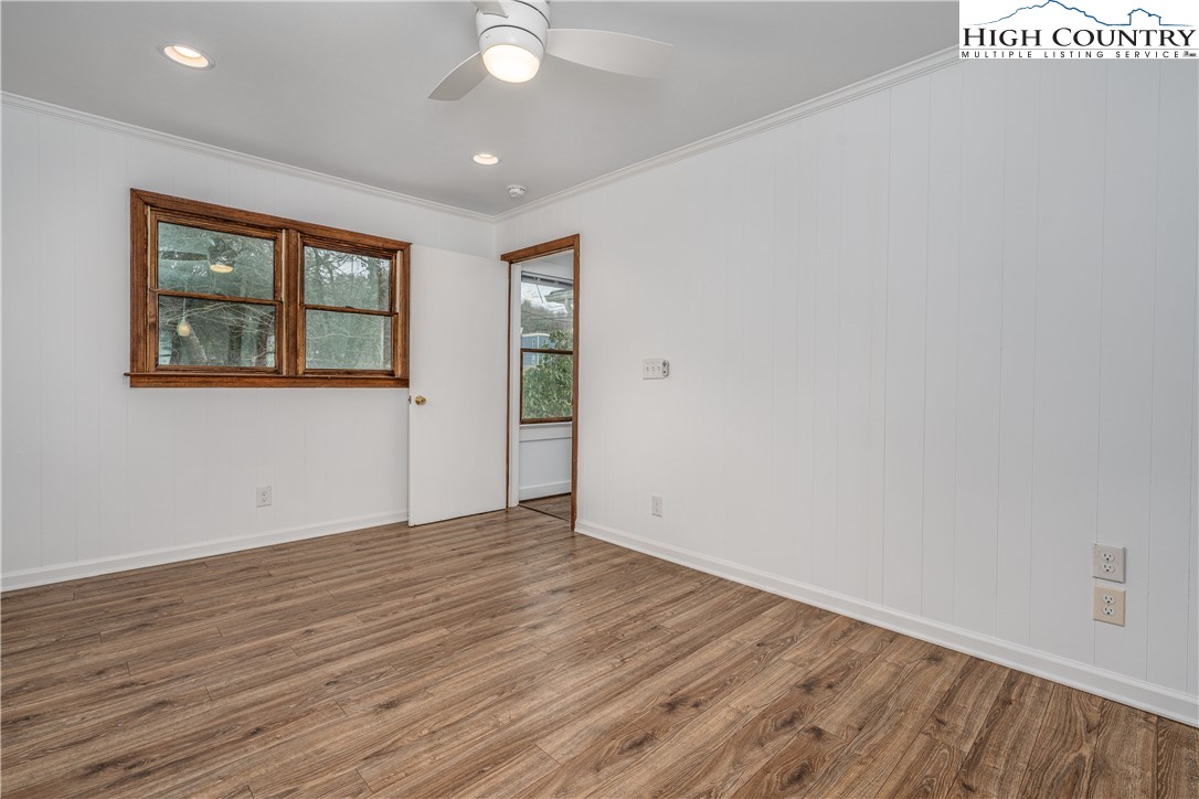 217 Highland Avenue Boone, NC 28607 - Photo 16 of 33 wooden floor in an empty room with a window