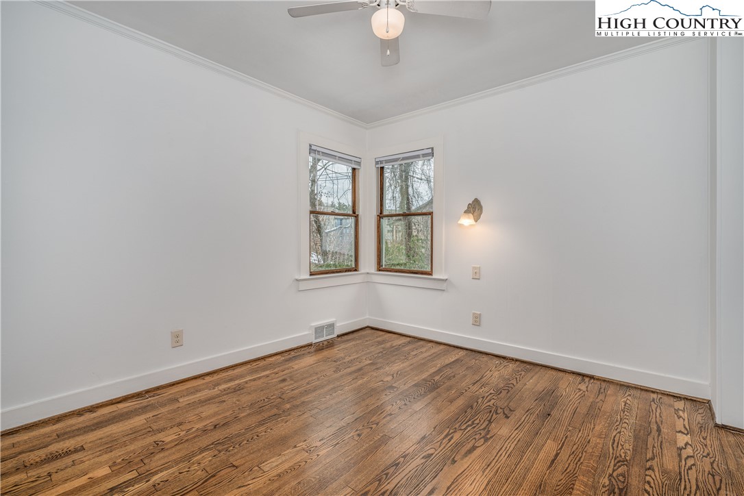 217 Highland Avenue Boone, NC 28607 - Photo 22 of 33 wooden floor in an empty room with a window