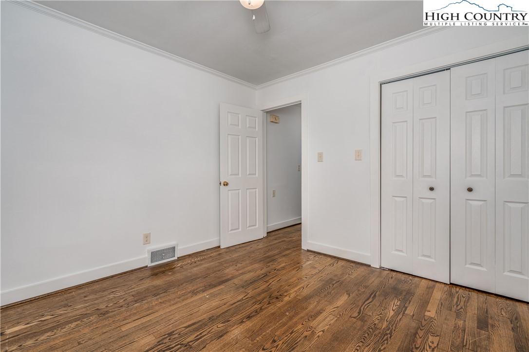 217 Highland Avenue Boone, NC 28607 - Photo 23 of 33 a view of an empty room with wooden floor