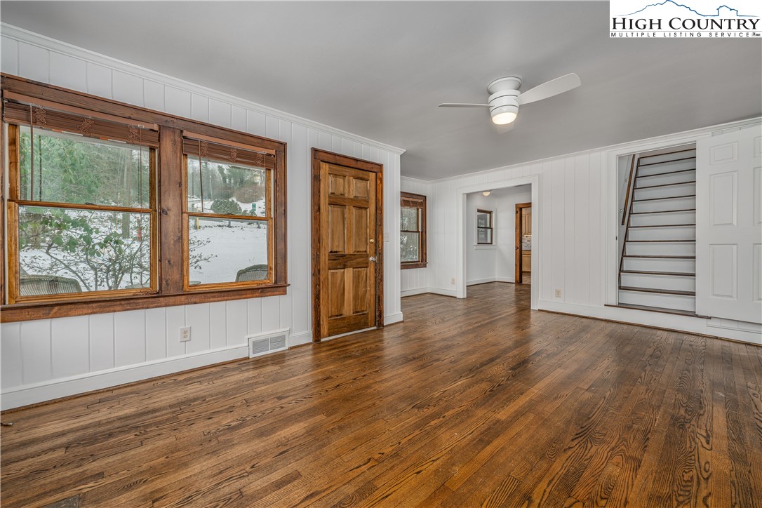 217 Highland Avenue Boone, NC 28607 - Photo 8 of 33 a view of an empty room with wooden floor and a window