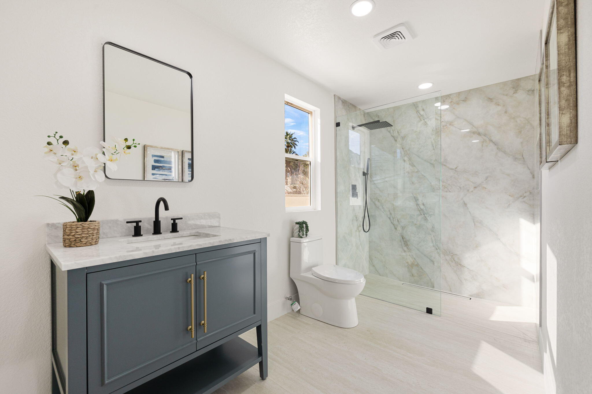 53770 Avenida Obregon La Quinta, CA 92253 - Photo 25 of 36 a spacious bathroom with a bathtub shower sink mirror and toilet
