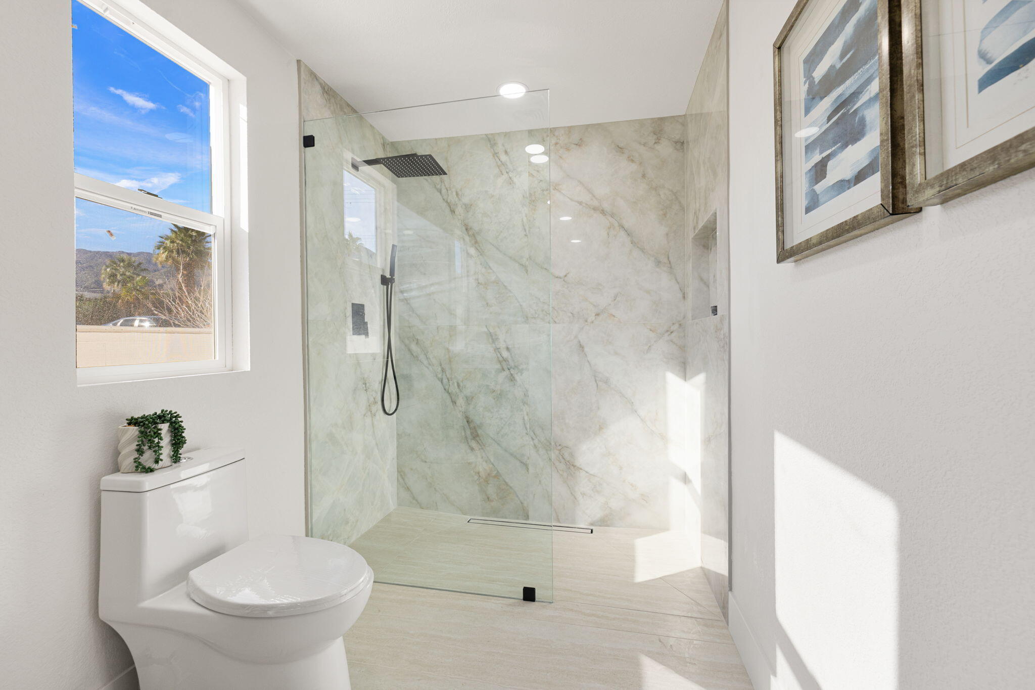 53770 Avenida Obregon La Quinta, CA 92253 - Photo 26 of 36 a bathroom with a shower and a toilet