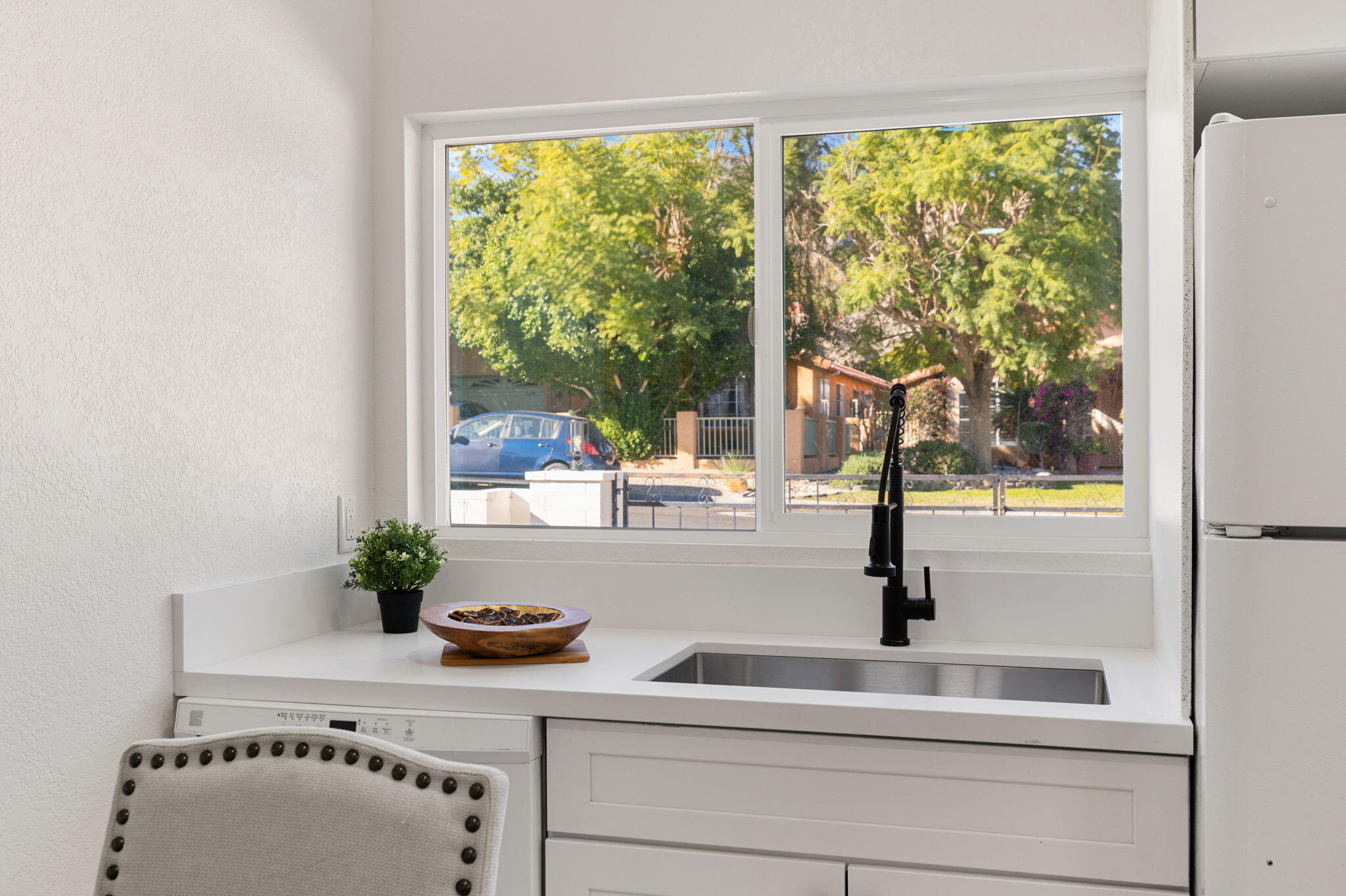 53770 Avenida Obregon La Quinta, CA 92253 - Photo 27 of 36 a bathroom with a granite countertop sink and a window
