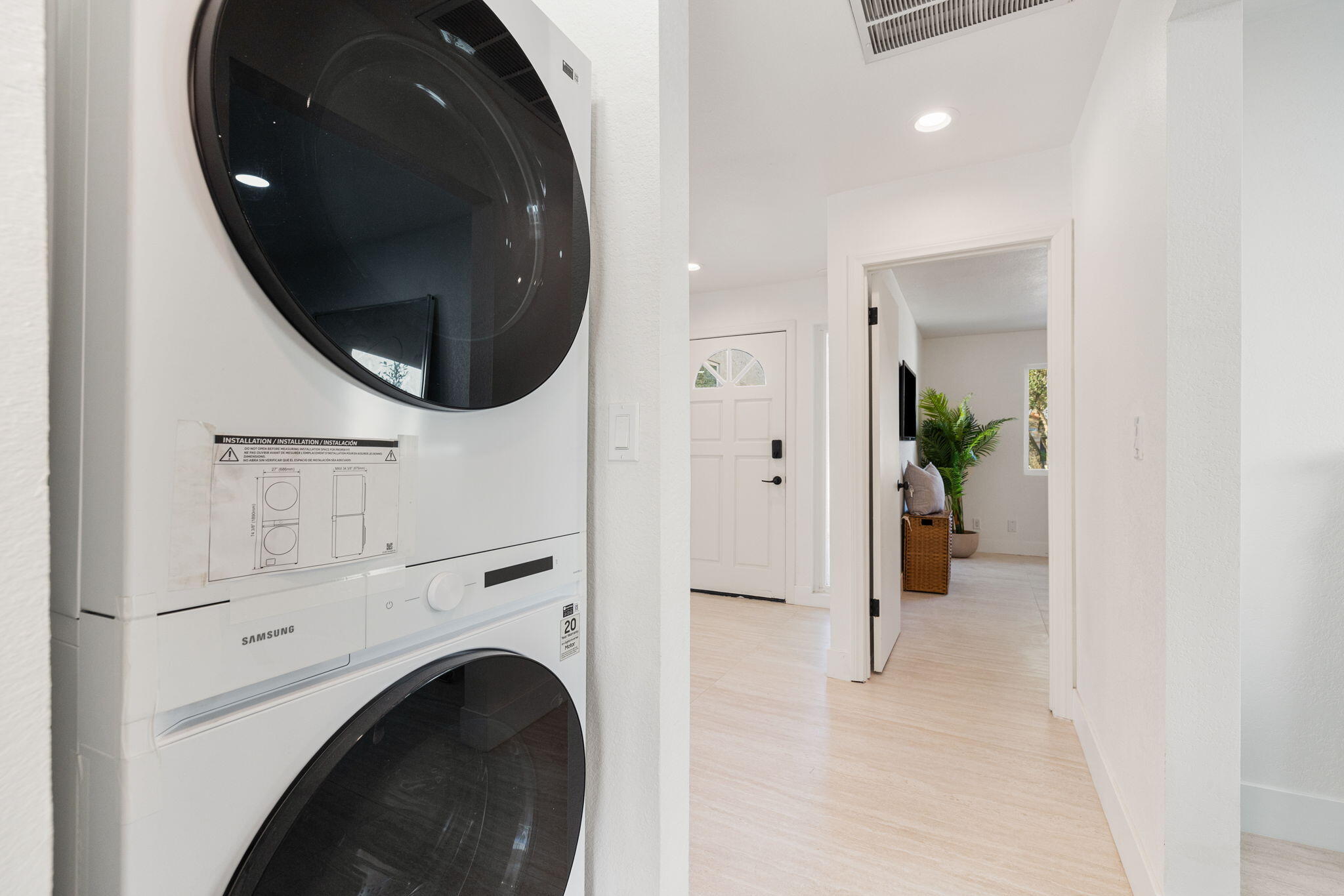 53770 Avenida Obregon La Quinta, CA 92253 - Photo 30 of 36 a view of a hallway with washer and dryer
