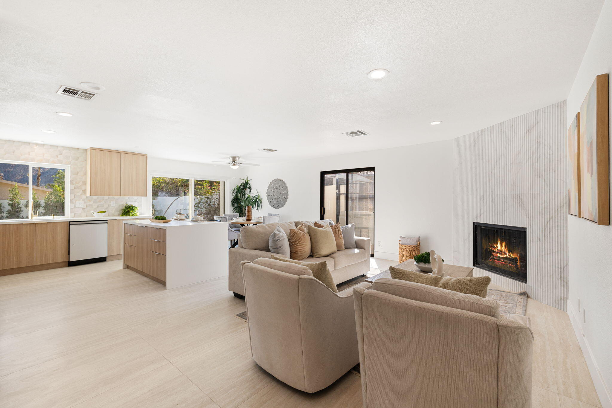 53770 Avenida Obregon La Quinta, CA 92253 - Photo 3 of 36 a living room with furniture and a fireplace