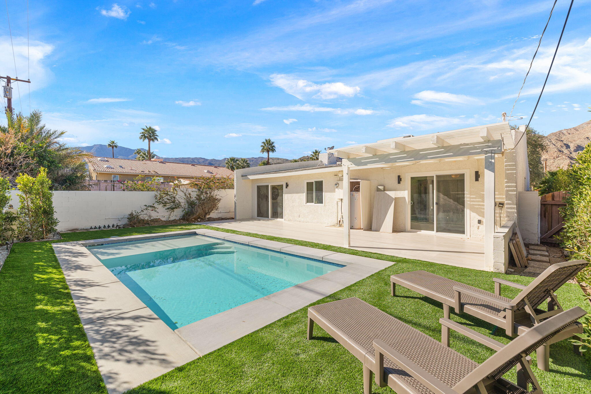 53770 Avenida Obregon La Quinta, CA 92253 - Photo 34 of 36 a view of a house with swimming pool and sitting area