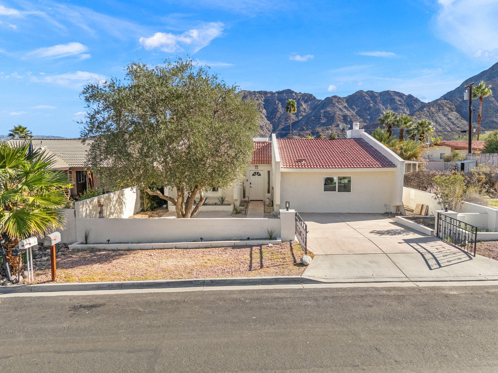 53770 Avenida Obregon La Quinta, CA 92253 - Photo 35 of 36 front view of house with a street view