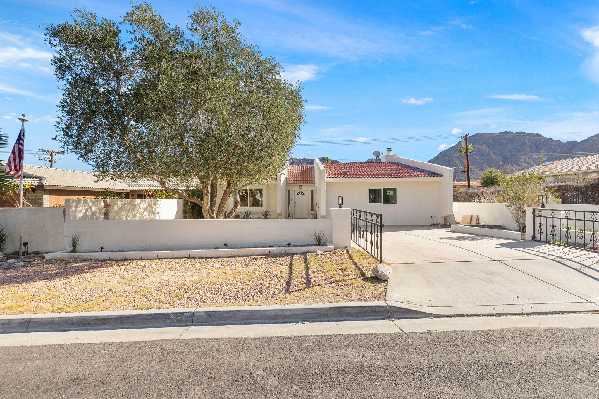 53770 Avenida Obregon La Quinta, CA 92253 - Photo 36 of 36 front view of house with a street