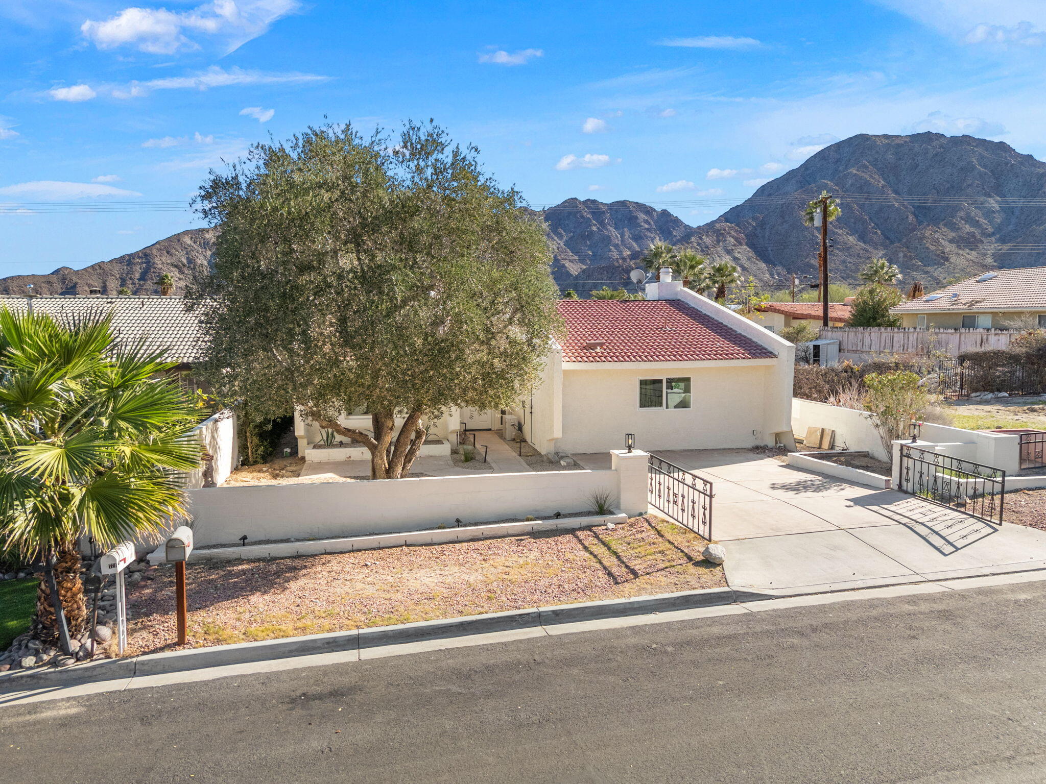 53770 Avenida Obregon La Quinta, CA 92253 - Photo 4 of 36 a view of a house with a yard